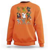 Orange halloween costume sweatshirt with colorful spooky character dabbing graphic