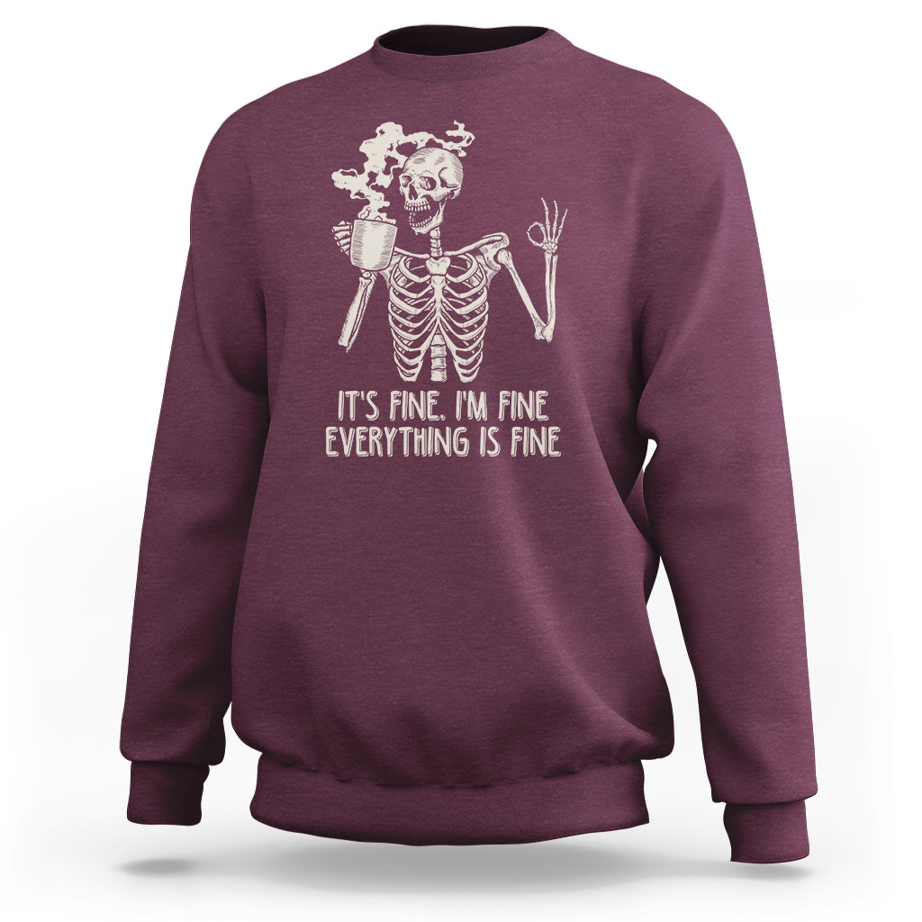 Maroon crewneck skeleton sweatshirt with coffee cup and “It’s fine, everything’s fine” print