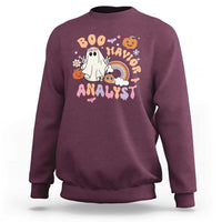 Maroon crewneck sweatshirt with Halloween “Boo Analyst” graphic, ghost, rainbow, pumpkins