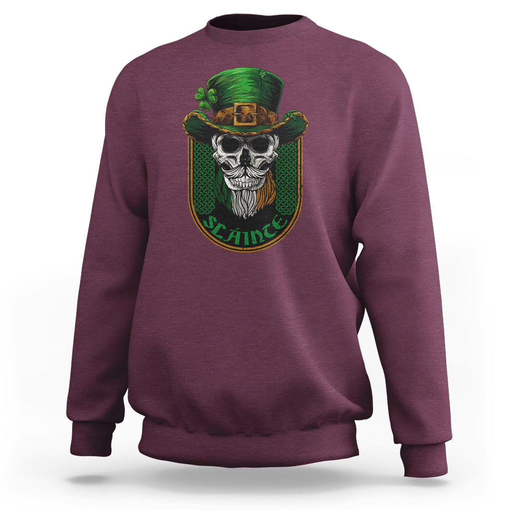 Maroon crewneck sweatshirt with green skull graphic on the chest