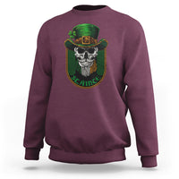 Maroon crewneck sweatshirt with green skull graphic on the chest
