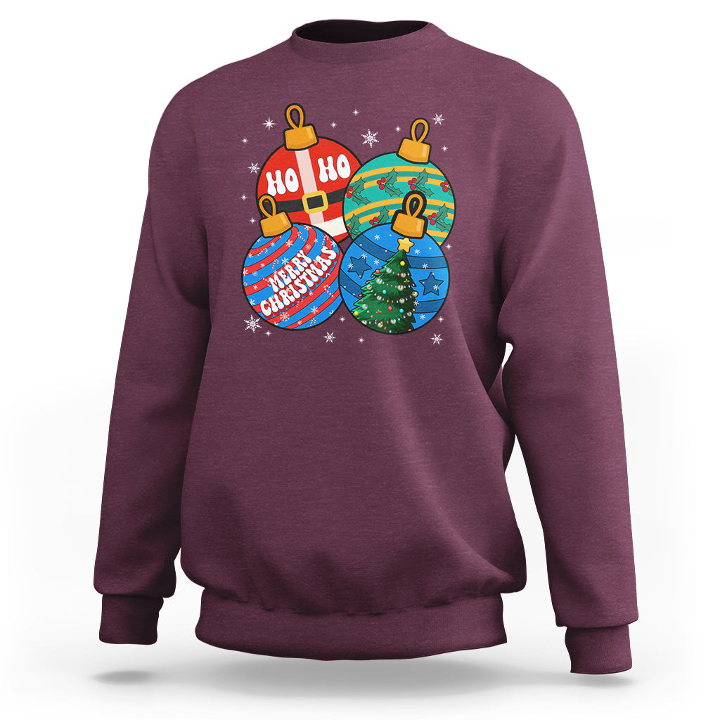 Maroon crewneck Christmas sweatshirt with colorful ornament graphic and "Ho Ho Ho" text