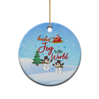 Blue ceramic circular ornament with Joy to the World, sleigh, and two snowmen.
