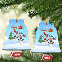 Blue ceramic bell ornament with Joy to the World, sleigh, and snowmen.