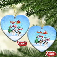 Blue ceramic heart ornament with Joy to the World, sleigh, and snowmen.