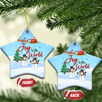 Blue ceramic star ornaments with Joy to the World text, sleigh, and snowmen.