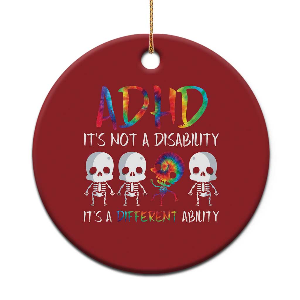 Red round ADHD awareness ornament with colorful text and skull graphic, hanging loop.