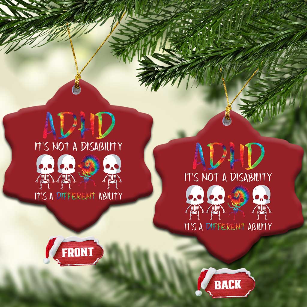 Two red heart-shaped ADHD awareness ornaments on pine branches, each with colorful skull graphic.