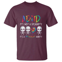 Maroon T-shirt with rainbow 'ADHD' text, skull graphic, and quotes: "It's not a disability"