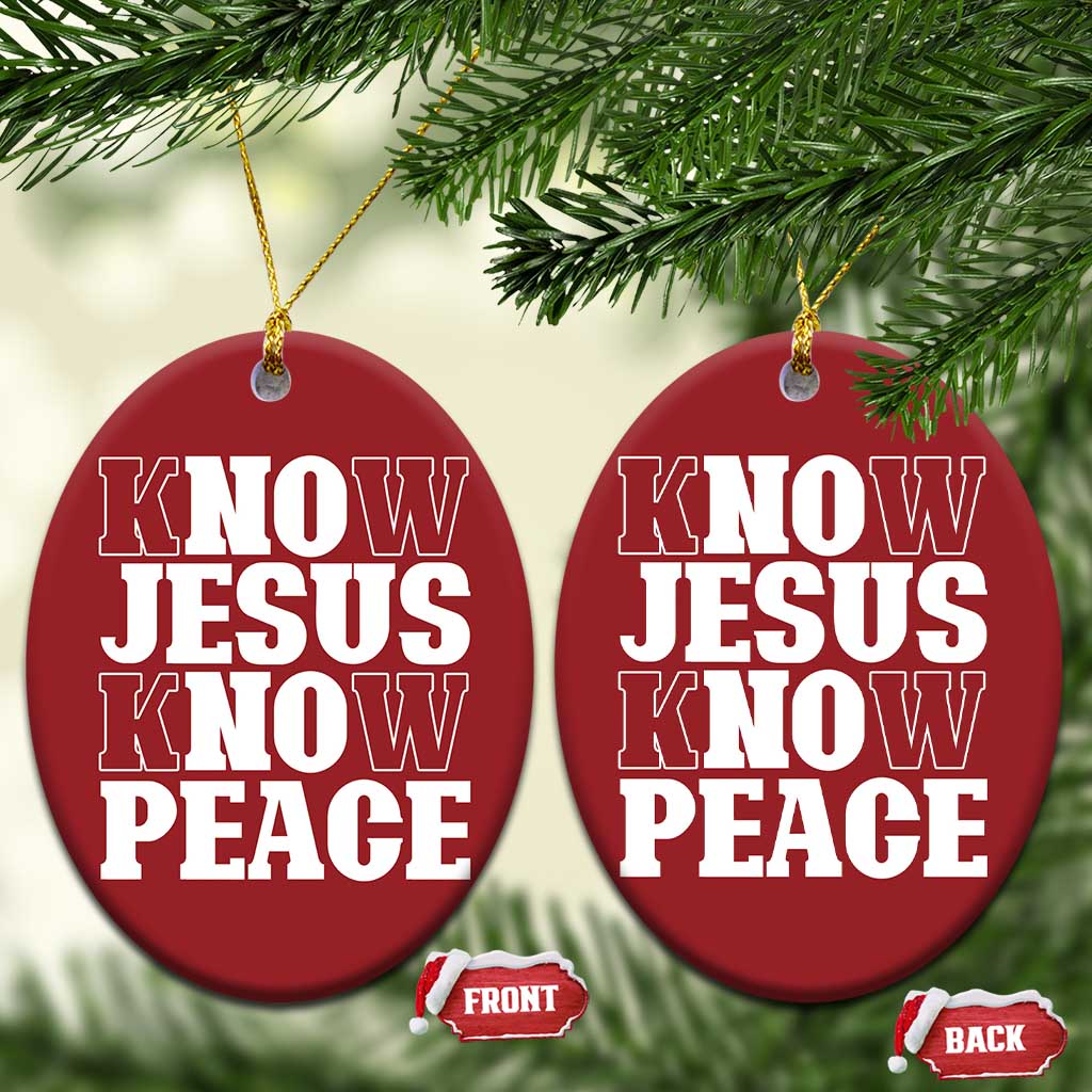 Two red circular Christmas ornaments with white “KNOW JESUS KNOW PEACE,” gold hanging strings.