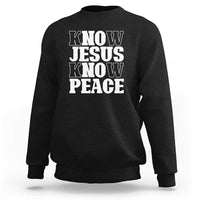 Black crewneck sweatshirt with "KNOW JESUS KNOW PEACE" graphic on the front.