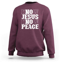 Maroon crewneck sweatshirt with "KNOW JESUS KNOW PEACE" graphic on the front.