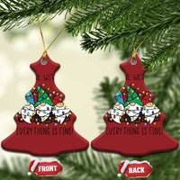 Red bell-shaped Christmas ornaments with gnome illustration and gold hanging loops