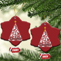 Two red star-shaped Christmas ornaments with white tree graphic; gold hooks and front/back labels