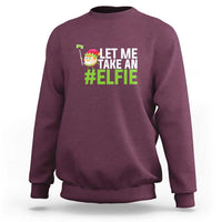 Maroon crewneck sweatshirt with 'Let Me Take an #Elfie' front graphic.