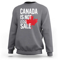 Dark heather crewneck sweatshirt with distressed 'Canada is not for sale' text and red maple leaf.