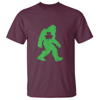St. Patrick's Day Bigfoot T-shirt, maroon with green Sasquatch clover graphic