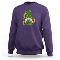 Purple St Patrick's Day gnomes sweatshirt with green shamrock sunflower graphic.