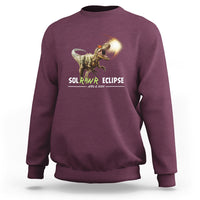Maroon dinosaur eclipse sweatshirt with front graphic, crewneck long sleeves