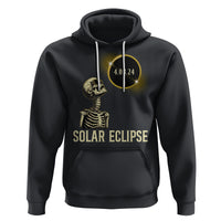 Black pullover hoodie with hood, front pocket, and solar eclipse skeleton graphic