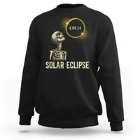 Solar eclipse skeleton sweatshirt in black with gold graphic and date 4.08.24