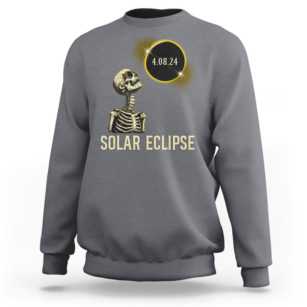 Solar eclipse skeleton sweatshirt in light gray with gold graphic and date 4.08.24