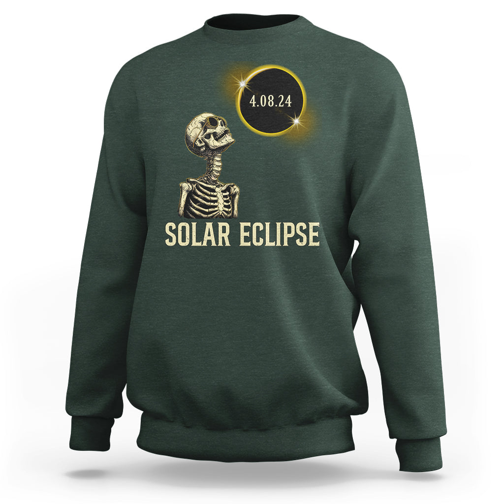 Solar eclipse skeleton sweatshirt in dark green with gold graphic and date 4.08.24