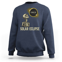 Solar eclipse skeleton sweatshirt in blue with gold graphic and date 4.08.24
