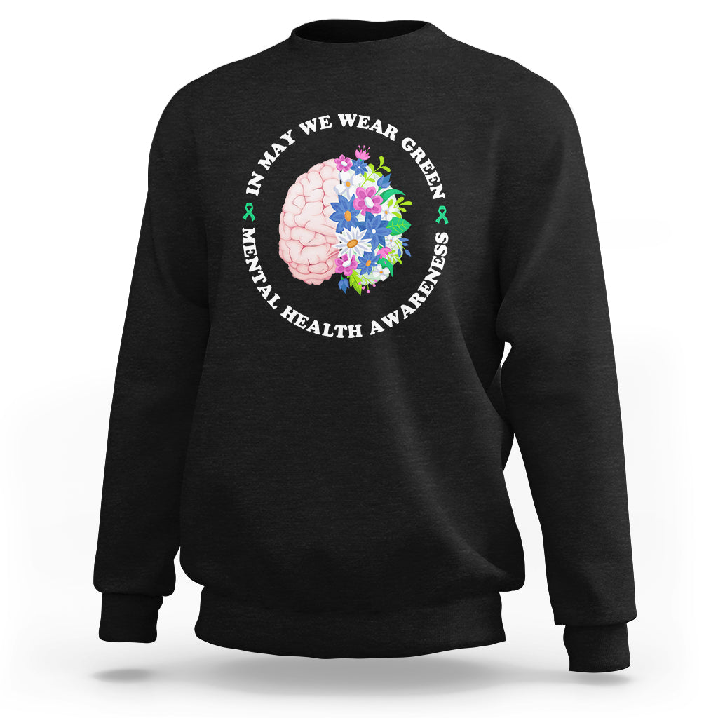 Black sweatshirt with back floral brain graphic and “wear green” mental health text