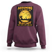 Maroon Halloween witch sweatshirt with moon and broomstick graphic and quote.