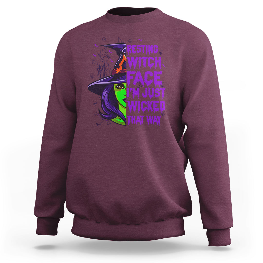 Maroon witch graphic sweatshirt with resting witch face chest print.