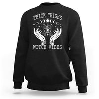Black sweatshirt with moon-phase witch graphic and crew neck, long sleeves