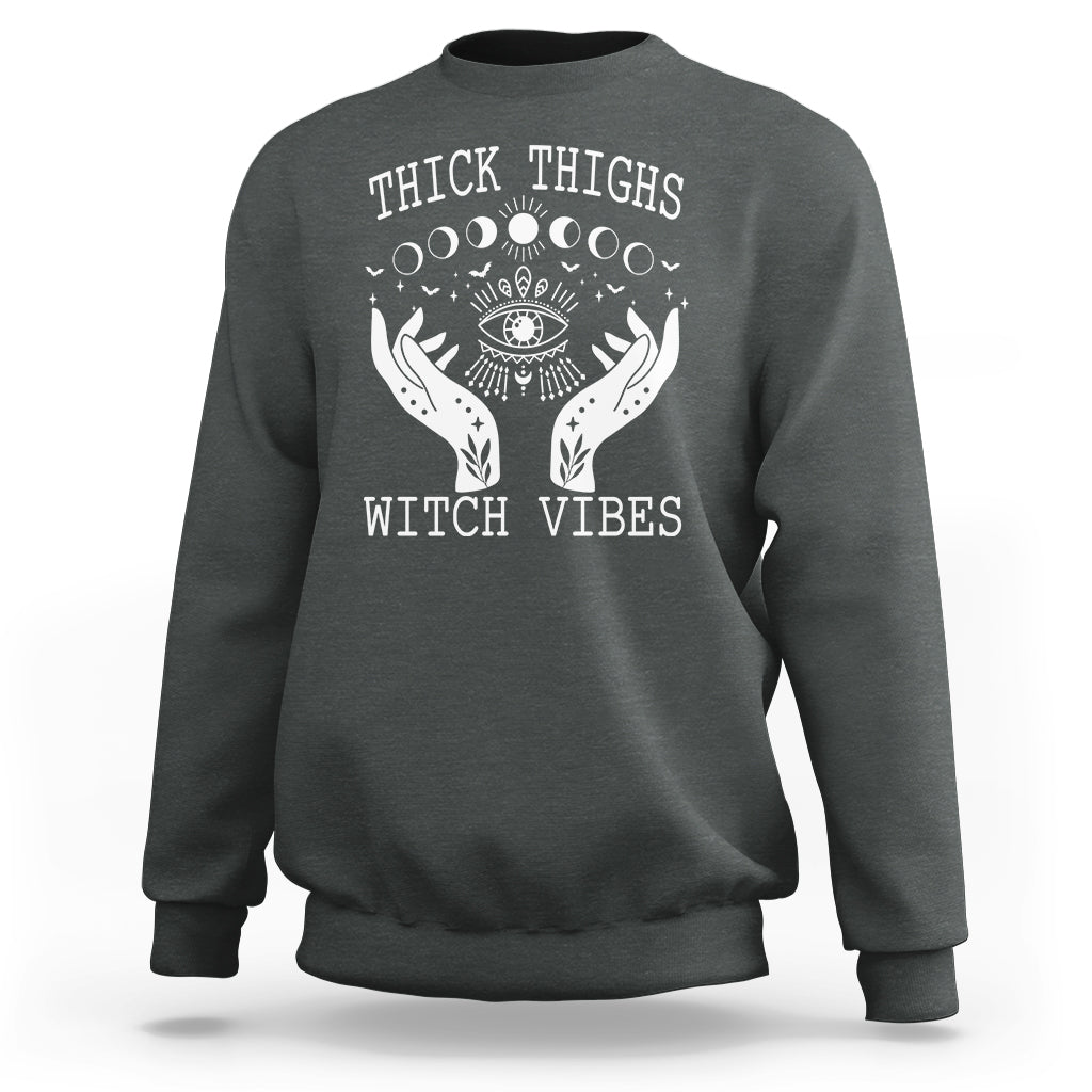 Dark heather sweatshirt with moon-phase witch graphic and crew neck, long sleeves