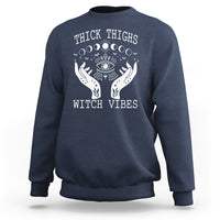 Navy sweatshirt with moon-phase witch graphic and crew neck, long sleeves