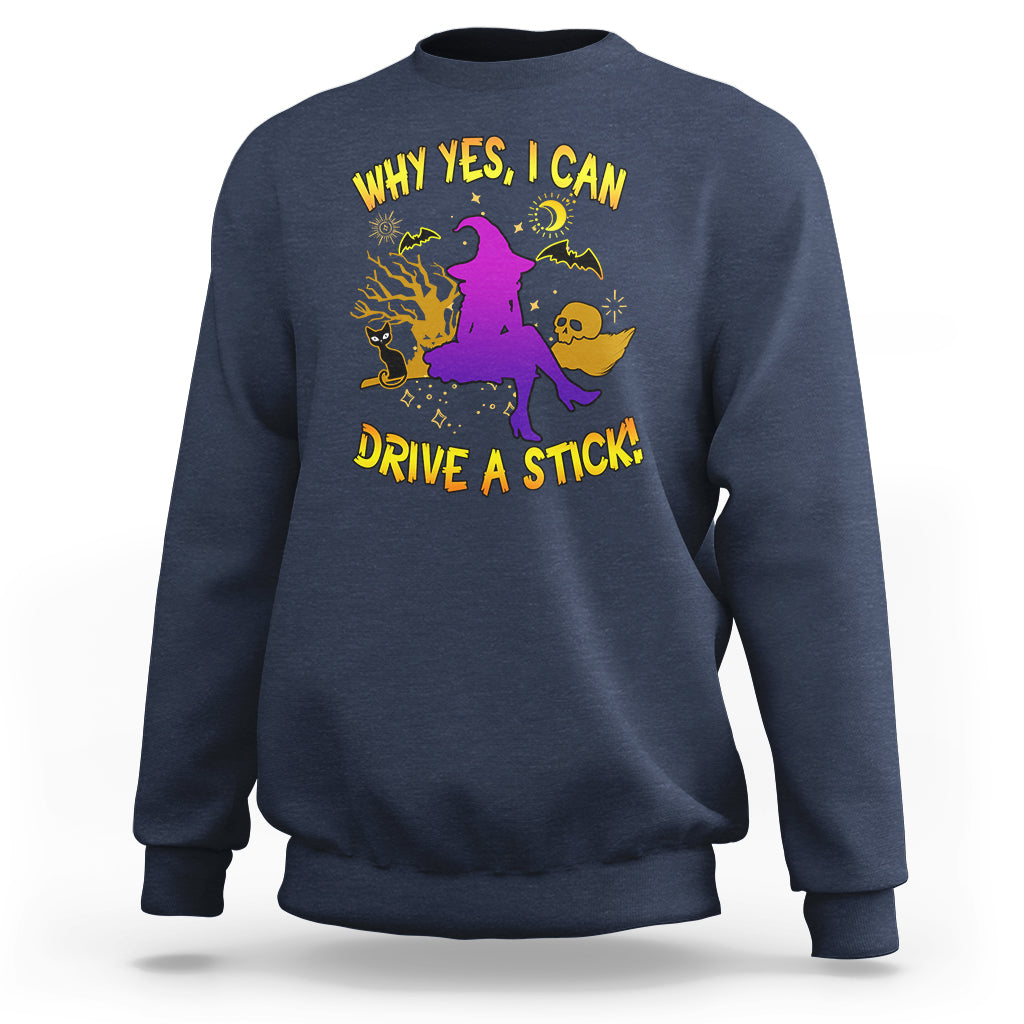 Navy Halloween witch sweatshirt with purple witch graphic and yellow 'DRIVE A STICK' text.