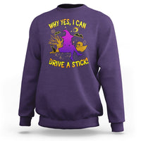 Purple Halloween witch sweatshirt with purple witch graphic and yellow 'DRIVE A STICK' text.
