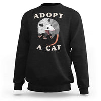 Dark charcoal sweatshirt with 'ADOPT A CAT' graphic on front, crewneck long sleeves