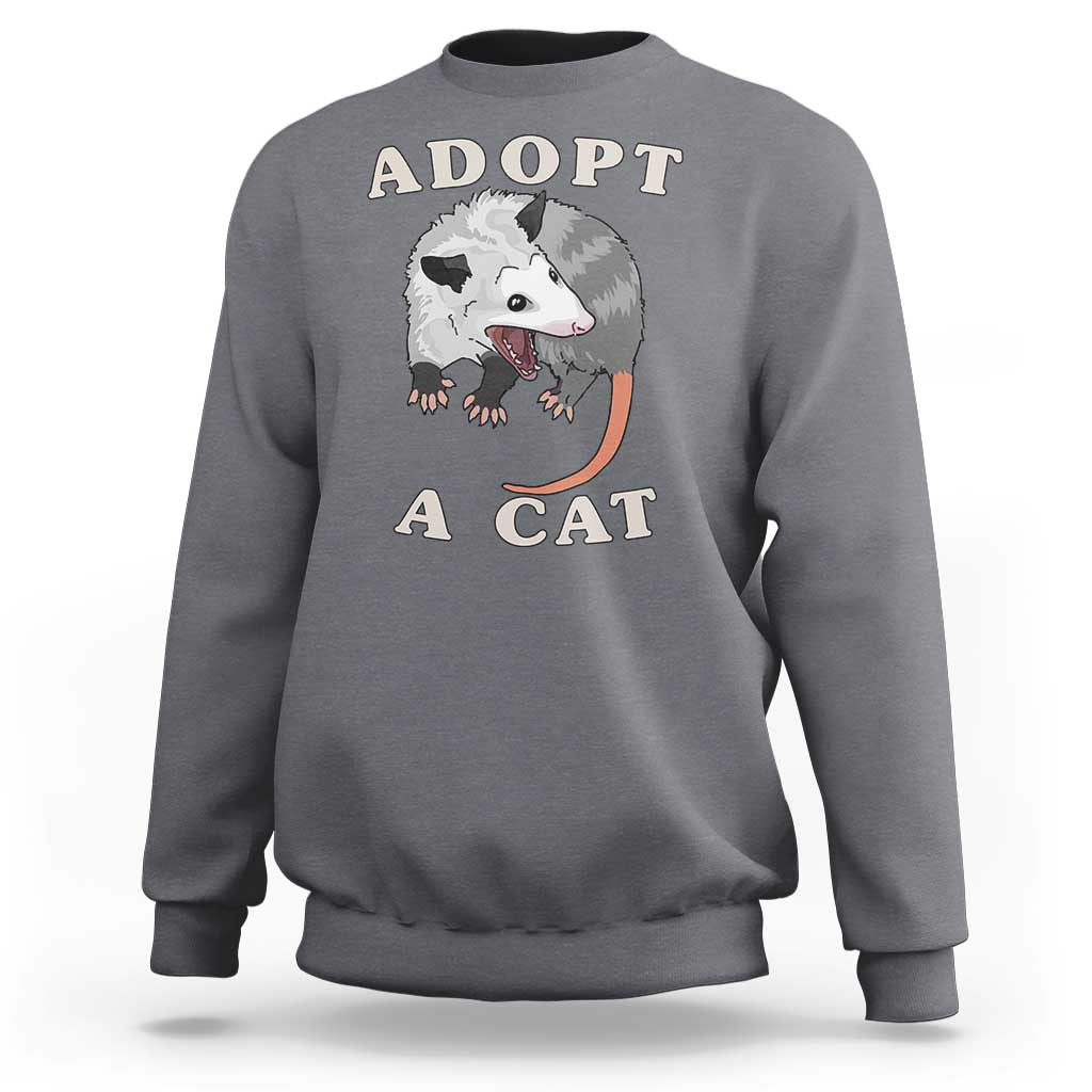 Gray sweatshirt with 'ADOPT A CAT' graphic on front, crewneck long sleeves
