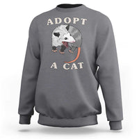 Gray sweatshirt with 'ADOPT A CAT' graphic on front, crewneck long sleeves