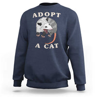 Navy sweatshirt with 'ADOPT A CAT' graphic on front, crewneck long sleeves
