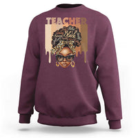 Maroon crewneck sweatshirt with front graphic portrait and Teacher text
