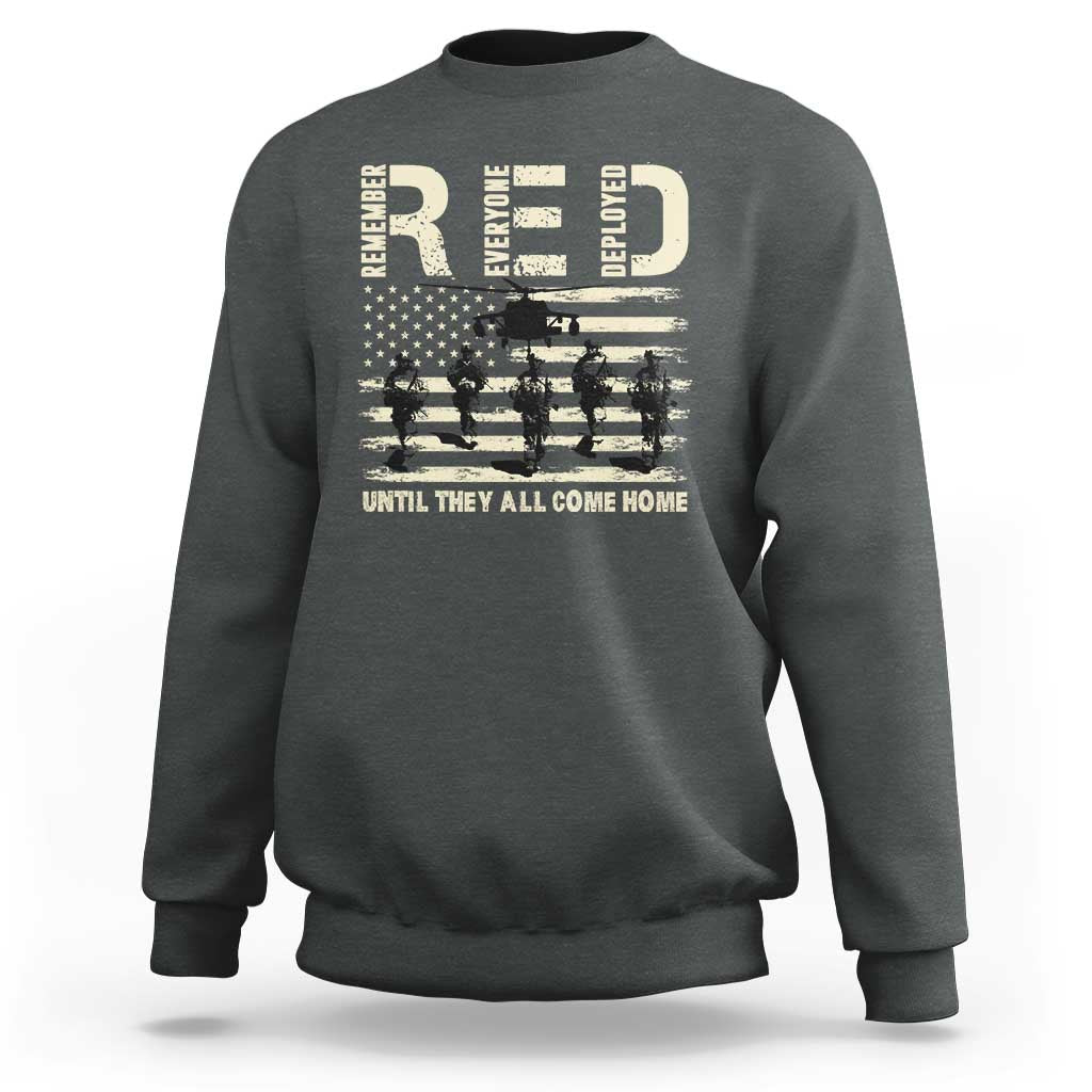 Olive green crewneck sweatshirt with soldier and stars-and-stripes graphic across chest