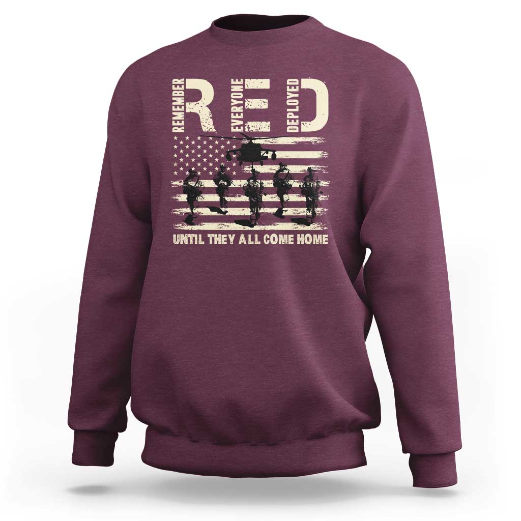 Maroon crewneck sweatshirt with soldier and stars-and-stripes graphic across chest