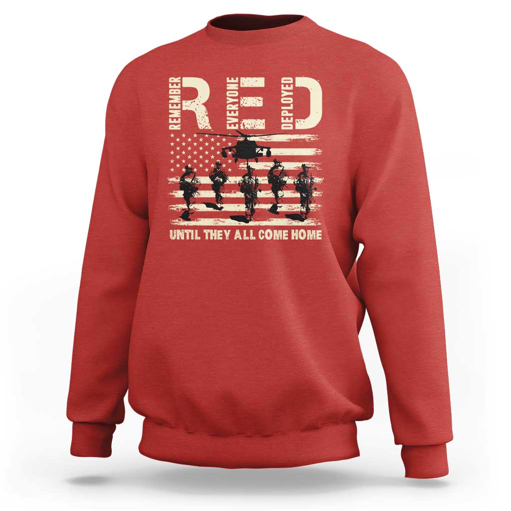 Red crewneck sweatshirt with soldier and stars-and-stripes graphic across chest