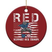 Red round Christmas ornament with gold hanging loop and “Support Our Troops” graphic