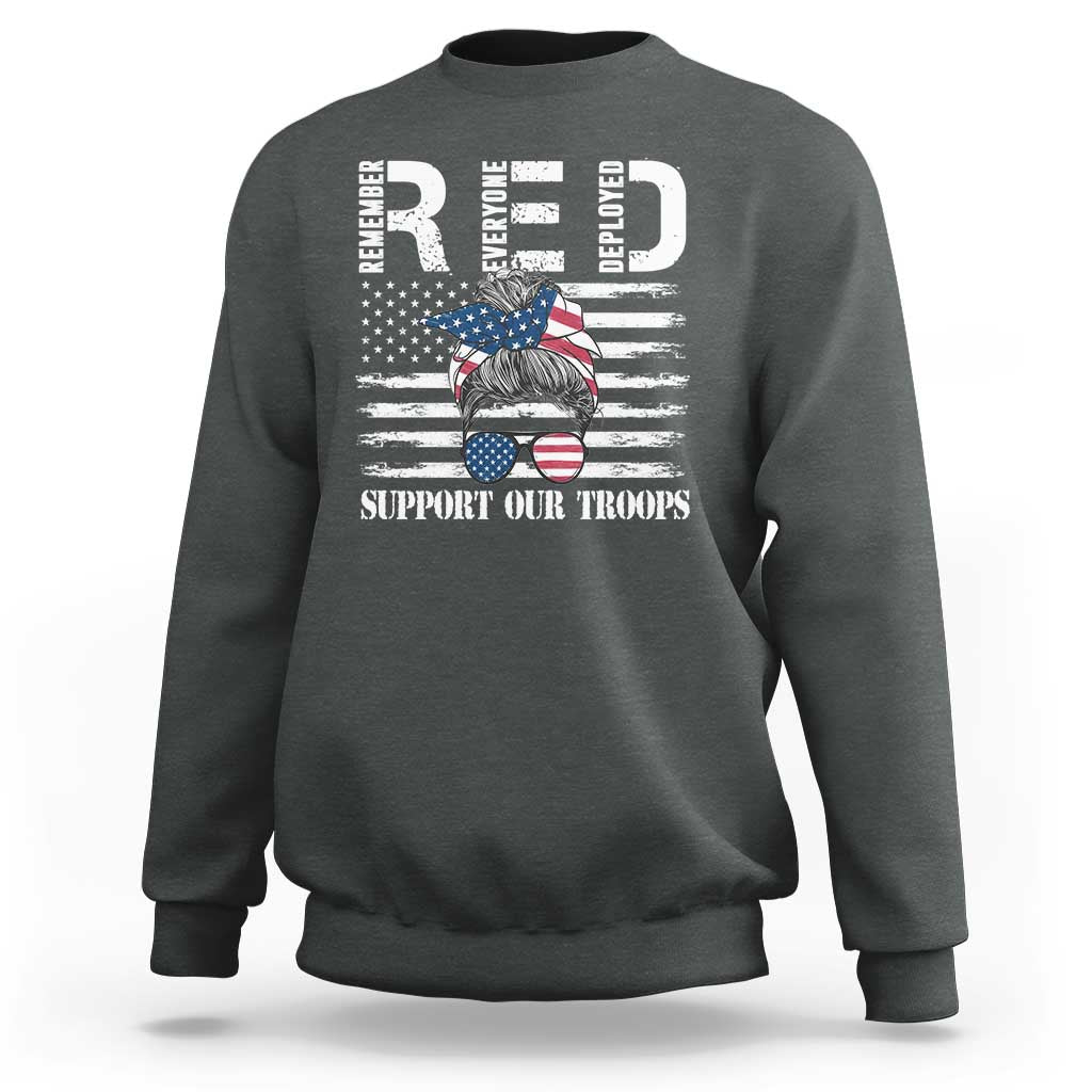 Dark heather crewneck sweatshirt with long sleeves and patriotic troops graphic on front