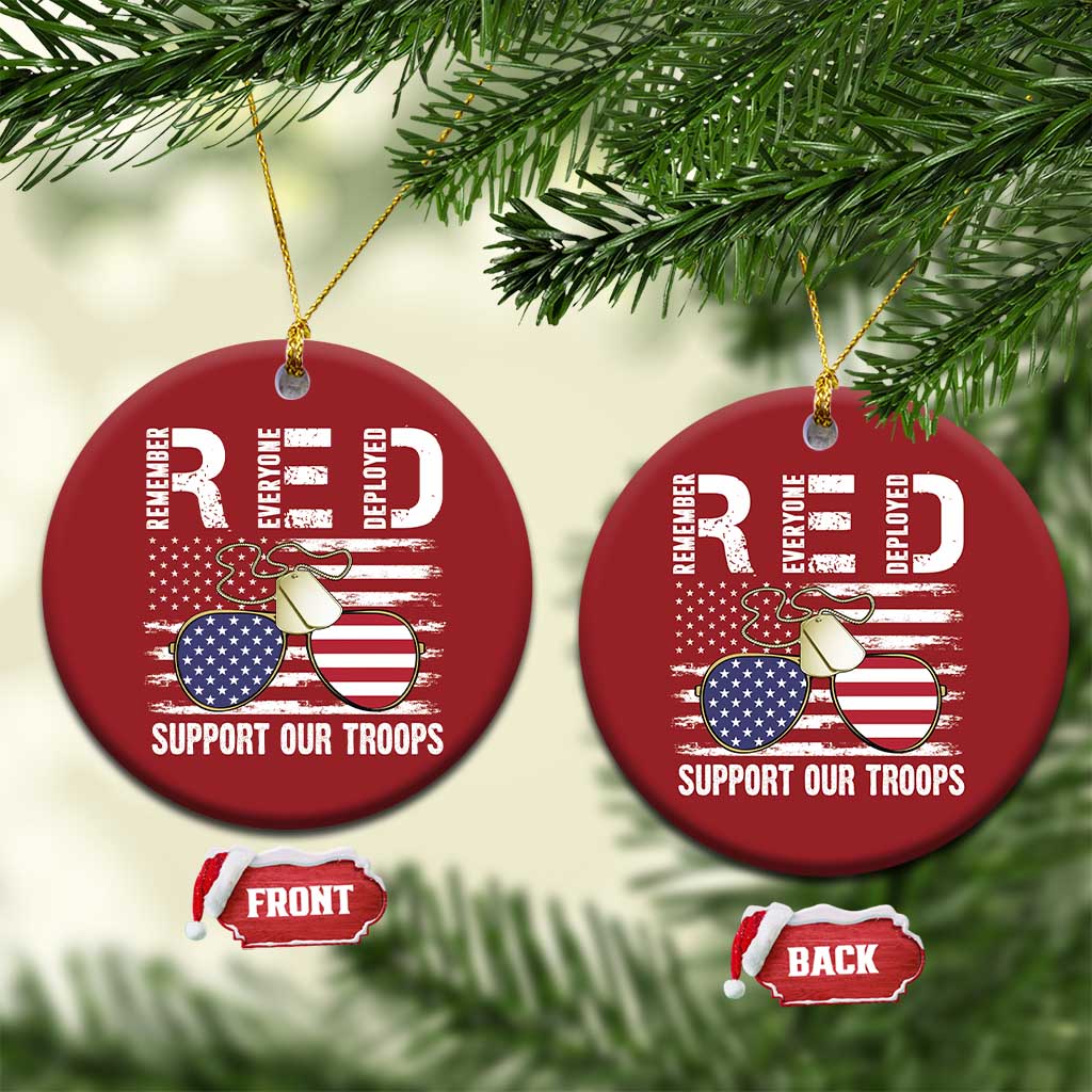 Set of red round Christmas ornaments with gold strings, eagle, flags, "Support Our Troops"