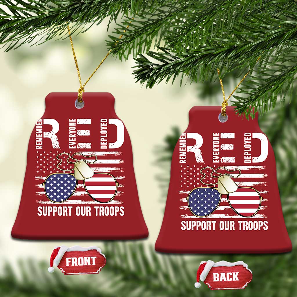 Pair of red bell-shaped Christmas ornaments with gold strings, eagle and flag, "Support Our Troops"