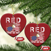 Two red heart-shaped Christmas ornaments with gold strings, eagle graphic and "Support Our Troops"