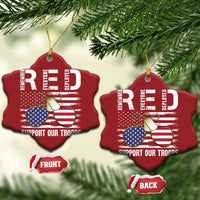 Two red heart-shaped Christmas ornaments with gold strings, flags and "Support Our Troops"